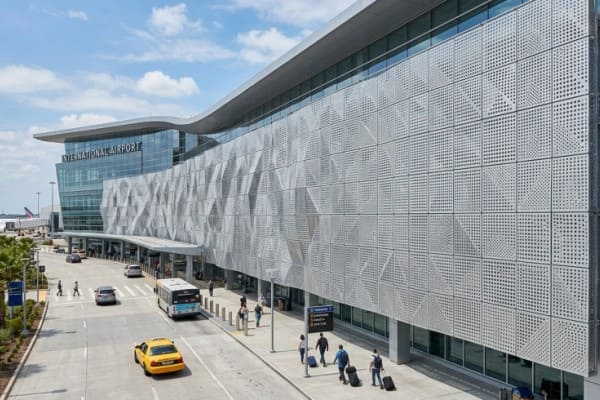 Airport terminal with perforated metal ceiling and facade panels