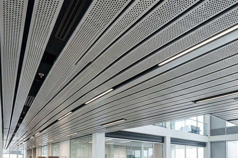 Metal plank ceiling with wood grain finish in hotel lobby