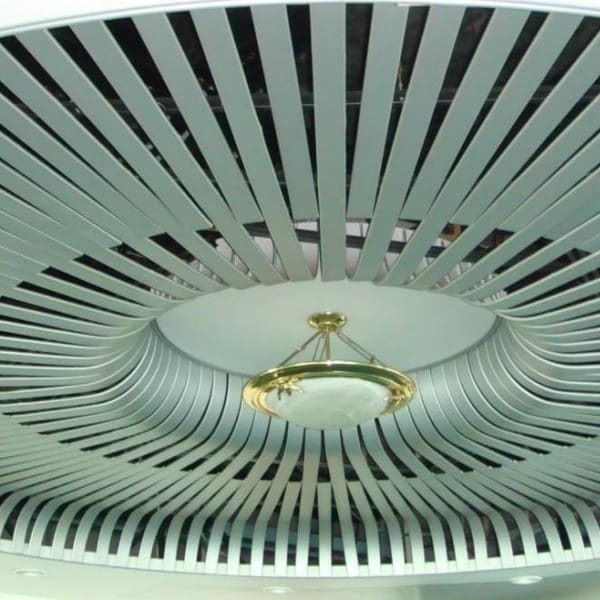 Metal plank ceiling with wood grain finish in a modern interior