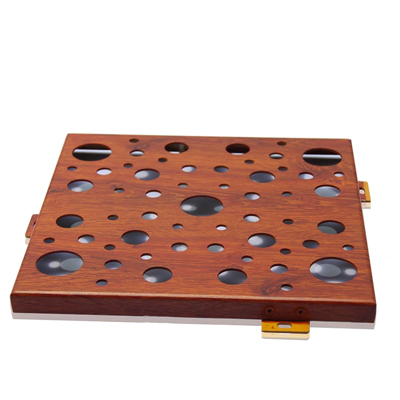 Close-up of perforated aluminum decorative panel with round hole pattern